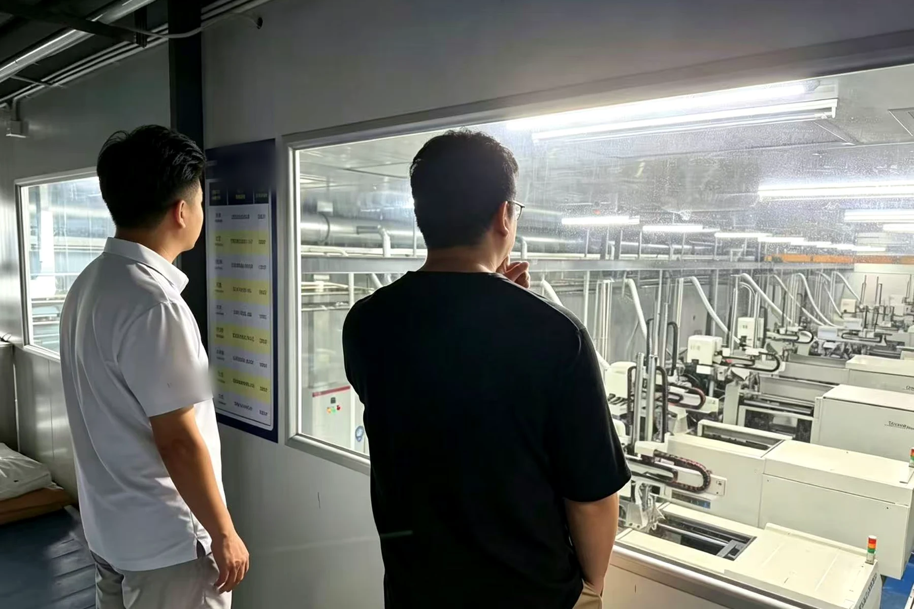 Vorexmed founder reviewing a controlled injection molding area with a manufacturing partner in China.